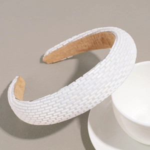 Close-up of white beaded headband showing hand-stitched sequins and anti-slip lining