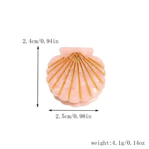 Detail view of pink shell-shaped hair claw with gold glitter lines and size measurements