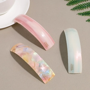 Three-piece set of acetate spring hair clips with elegant marble and pearl textures