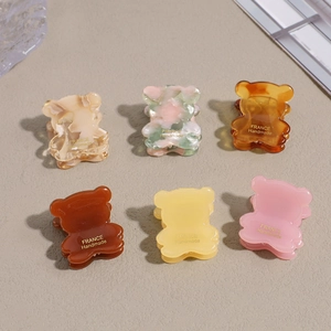 Set of 6 cute bear-shaped hair claws in marble and solid colors for stylish women