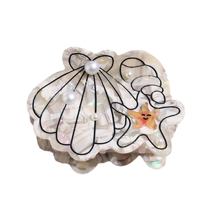 Pince à cheveux coquillage avec perles et design d'étoile de mer marbrée