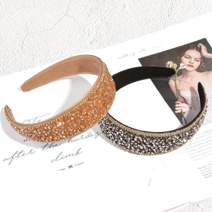 Luxurious wide padded headband featuring sparkling crystal beads in champagne and silver tones