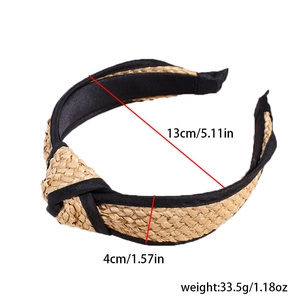 Detail showing natural straw woven headband dimensions with stylish top knot design