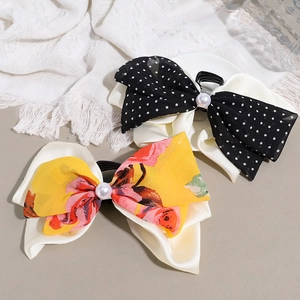 Elegant chiffon bow hair claws with faux pearl center in polka dot and floral styles