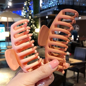 Matte acrylic hair claw clips for thick hair in peach pink and warm brick red colors