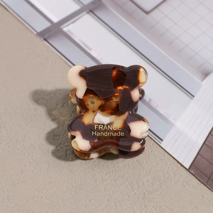 Macro detail of high-quality tortoiseshell acetate bear-shaped hair clip for women