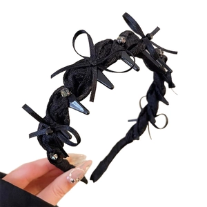 Elegant black satin bow headband with rhinestones and inner teeth for hair styling