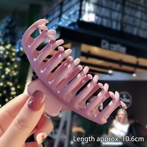 Detail showing a 10.6cm frosted large hair claw clip in dusty rose pink finish