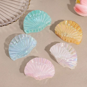 Five-pack iridescent shell hair claws in assorted pastel colors for beach vacation styles