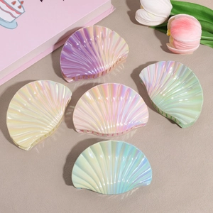 Five pearlescent seashell hair claws in pastel colors for elegant summer styling