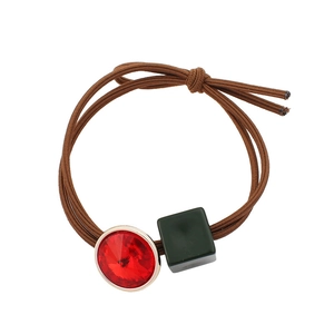 Elegant elastic hair tie with red rhinestone gemstone and green square charm detail