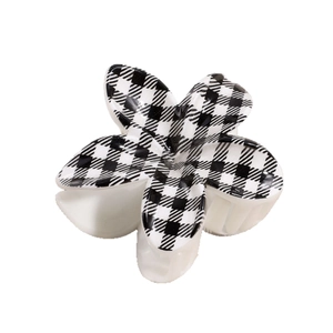 Checkerboard pattern flower hair claw clip with black and white grid design for women