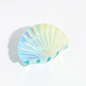 Detailed view of the holographic light blue shell hair claw with iridescent finish