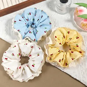 Three-piece set of sweet cherry print lace scrunchies in blue and yellow plaid patterns