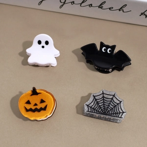 Halloween mini hair claw clip set featuring ghost, bat, pumpkin and spider web designs