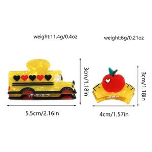 Detailed view of yellow school bus and apple acrylic hair claws with size dimensions