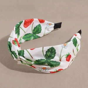 Fashionable white wide headband with red strawberry print and stylish top knot design