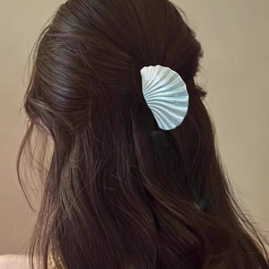 Iridescent shell-shaped hair claw clip with colorful pearl finish for elegant styling