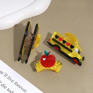 Three-piece school bus and apple hair claw clips set with a yellow pearlescent finish