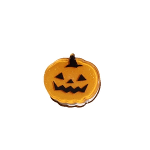 Mini orange pumpkin hair claw clip with black face print for Halloween styling
