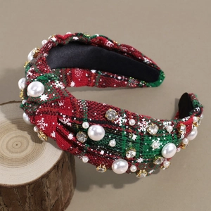 Detail of Christmas plaid knot headband with festive pearls and sparkling rhinestones