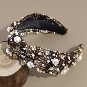 Detailed close-up of Christmas plaid headband with hand-sewn pearls and rhinestones