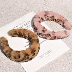 Retro plush leopard print headbands in pink and brown faux fur for winter styling