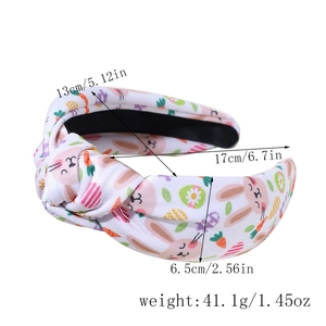 Detailed view of white Easter headband dimensions with bunny and egg print patterns