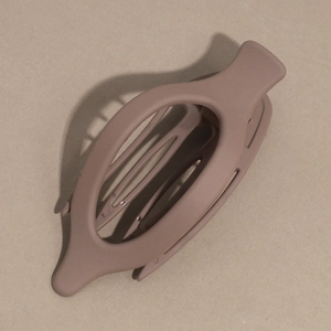 Detailed view of coffee-colored matte oval hair claw clip with non-slip interior teeth