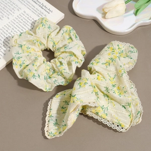 Floral yellow scrunchie and lace hair ribbon set with delicate green flower patterns