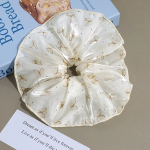 Elegant floral mesh scrunchie with yellow butterfly prints and silver rhinestones
