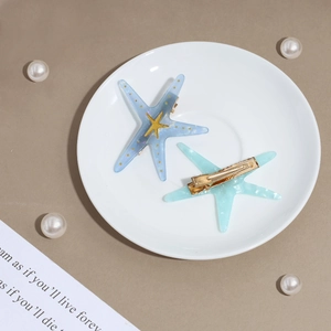 Lot de deux jolies barrettes étoile de mer bleues avec paillettes d'or et marbre