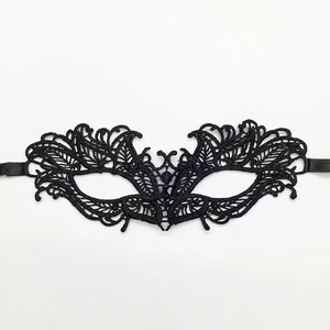 Detailed close-up of black lace fox mask with intricate embroidery for Halloween party