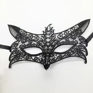 Detailed view of black lace fox mask with intricate hollow out weaving for cosplay costume