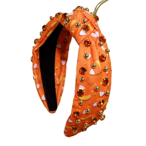 Cerchietto Halloween arancione con nodo, strass e motivi a caramella candy corn