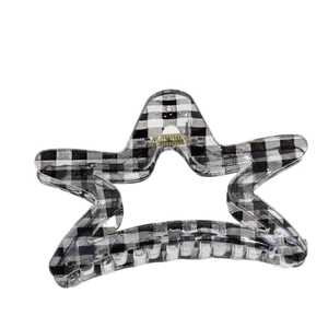 Star shaped hair claw clip with black and white gingham pattern on white background