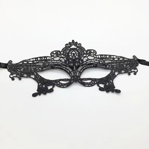 Detailed close-up of the intricate black lace weave and floral pattern on the fox mask