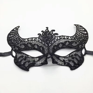 Detailed view of black lace eye mask with intricate hollow patterns and satin ribbon ties