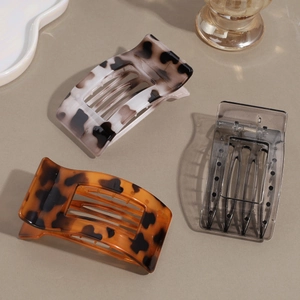 Three rectangular leopard print hair claws in acetate finish for elegant hair styling