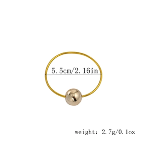 Detail view of gold elastic hair tie with large polished ball bead showing 5.5cm diameter