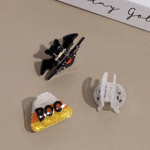 Three-piece Halloween hair clips set featuring bat, ghost and glittery BOO candy designs