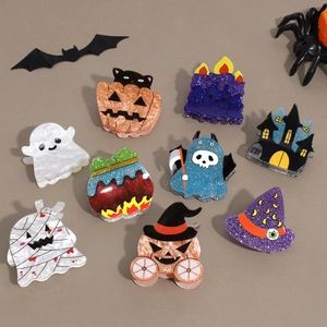 9-piece Halloween hair claw set with glittery pumpkin, ghost, and witch hat designs