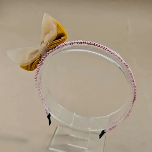 Detail of Korean style mesh bow headband with layered yellow satin and beige organza fabric