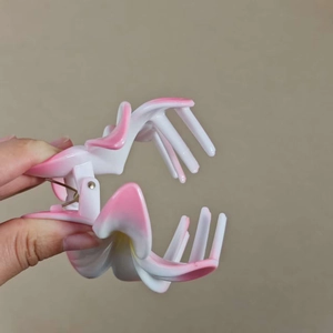 Pink and white gradient flower claw clip for elegant beach vacation hair styling