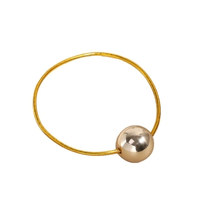 Golden high-elastic hair tie with a minimalist polished metal sphere on white background