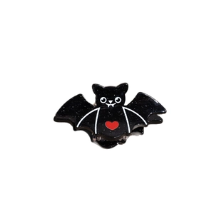 Halloween black bat hair claw clip with glitter finish and a small red heart