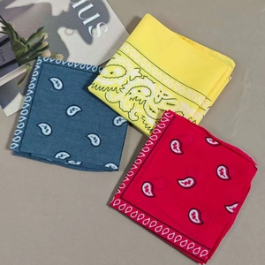 Three-piece set of paisley cotton bandanas in bright yellow, deep blue, and vibrant red colors
