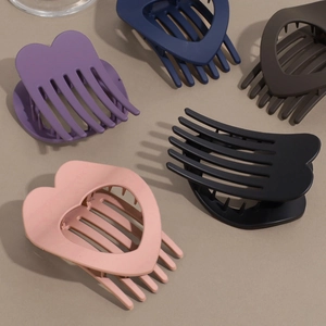 Matte heart-shaped hair claw clips in multiple colors with hollow minimalist design