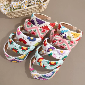 Floral knitted wide headband with colorful crochet flowers and pastoral style knot detail