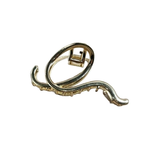 Elegant gold wavy alloy hair claw clip with minimalist curved design for women's hairstyles